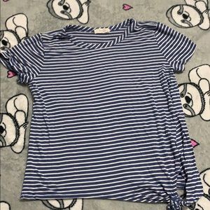 Blue and White striped with knot at bottom shirt.